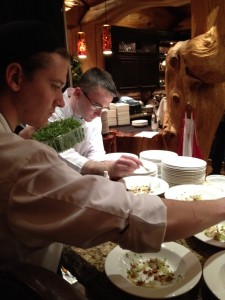 Marc Lepine (on the right) plating a dish. Photo by Karl Wells