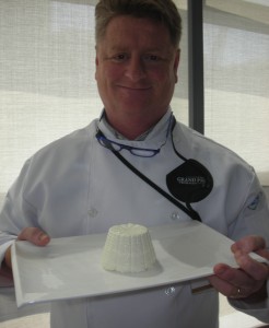 Chef Michael Howell, one of the judges, presents the 2013 Grand Champion cow's milk cheese of Canada